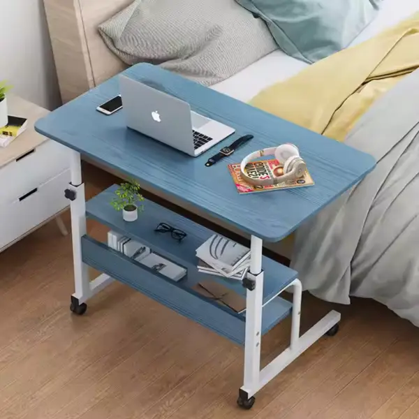 Blue adjustable desk with storage shelves and laptop on top