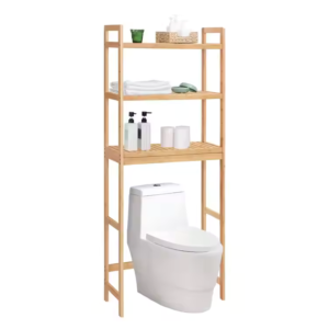 Bamboo bathroom storage rack with three shelves placed above a toilet, holding towels, toiletries, and bathroom essentials