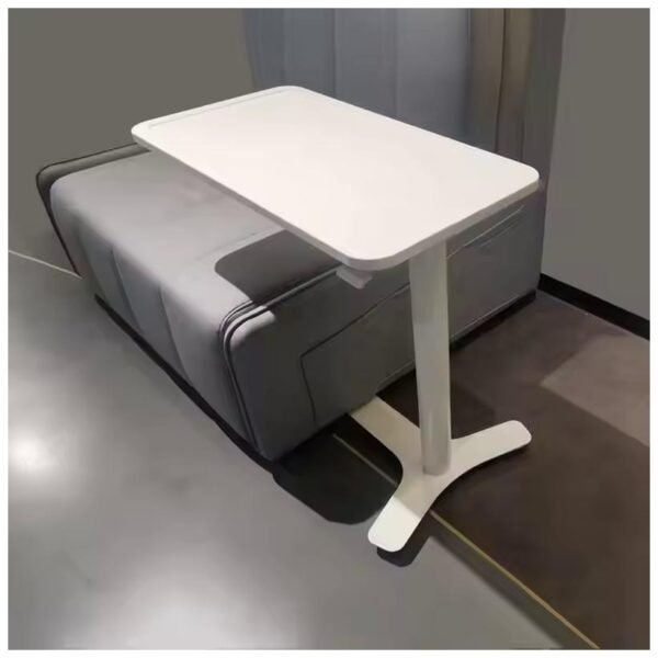 A modern minimalist white small side table positioned next to a gray sofa