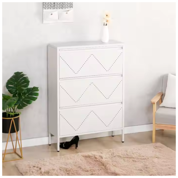 White 3-drawer storage cabinet with geometric design, placed in a living room setting