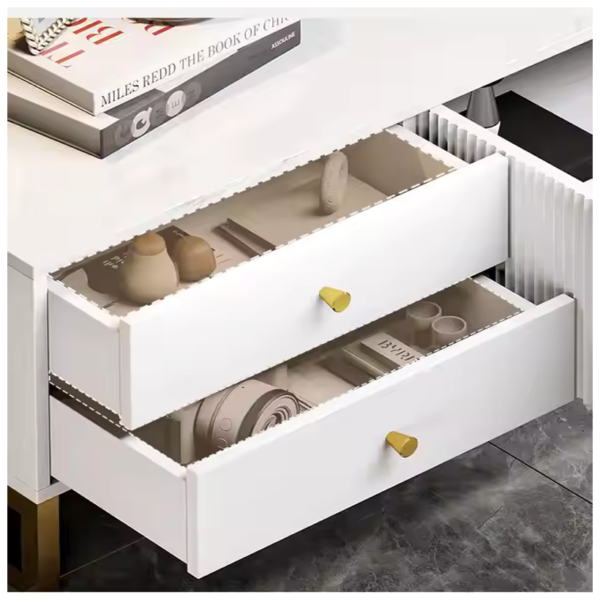 White drawer with golden handle showing decorative items
