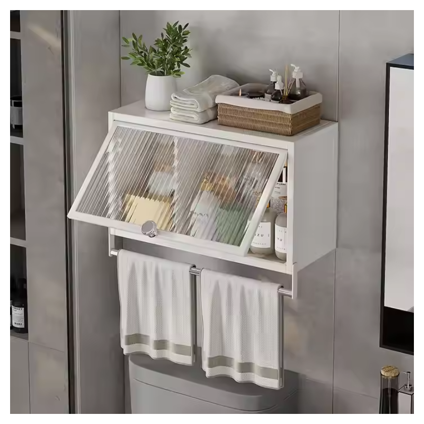 White storage cabinet with an angled glass door, displaying bottles and towels, with towel racks below.